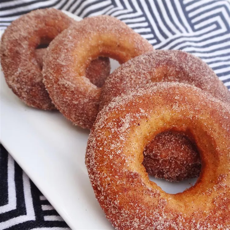 A cake donut recipe that's simple to make and lightly spiced with cinnamon and nutmeg.